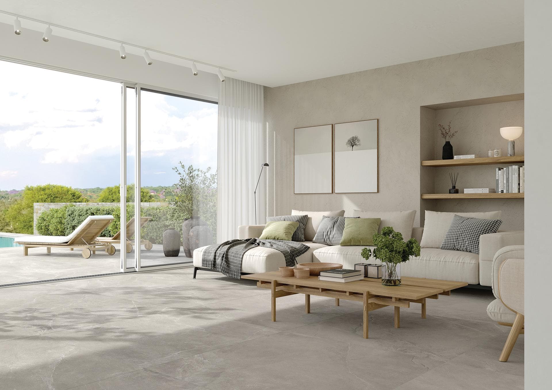 Soggiorno con terrazza e pavimento effetto pietra Soggiorno con divano chiaro e vetrata sulla terrazza con piscina, pavimento in gres effetto pietra grigio