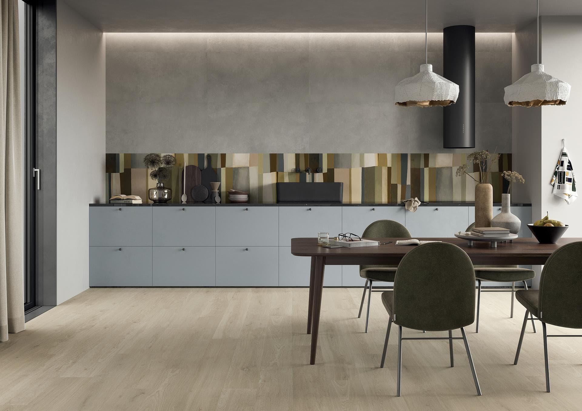 Kitchen and dining area with wood floor and grey wall Kitchen with pale wood-look floor, smoke grey wall and multicoloured geometric patterned backsplash