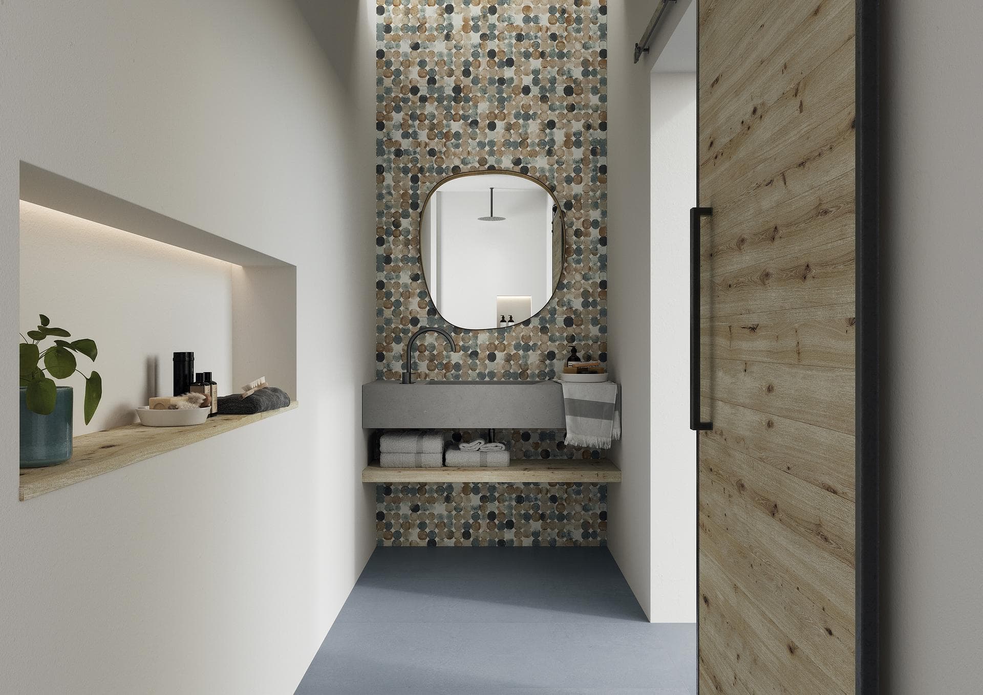 Bathroom with patterned wall and avio floor Narrow bathroom with multicoloured dot-patterned back wall, matt avio floor, washbasin and oval mirror