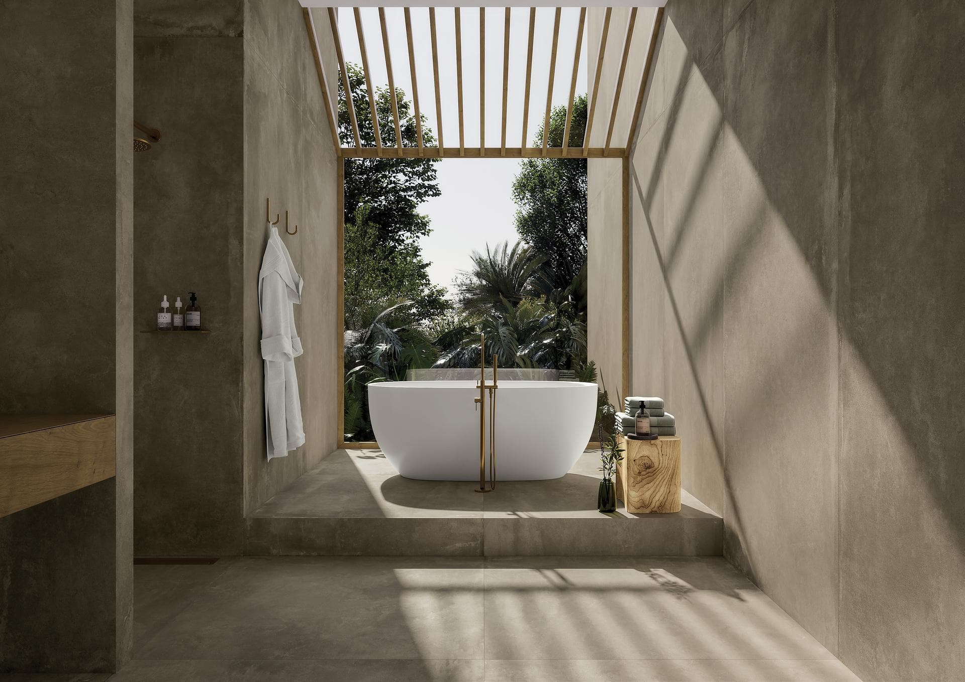 Salle de bains effet béton taupe avec baignoire îlot Salle de bains avec baignoire îlot sur estrade, murs et sol en grès effet béton taupe mat