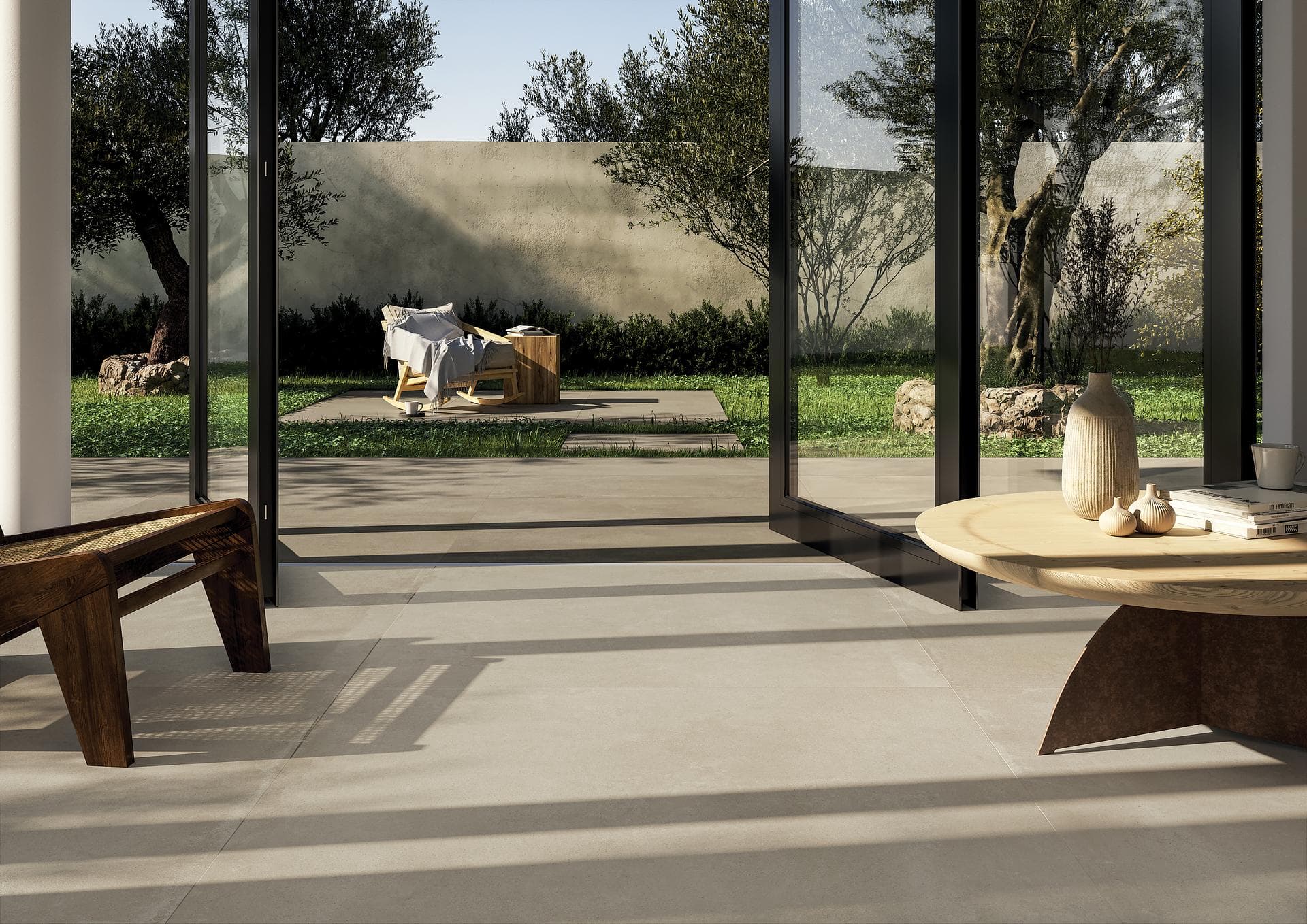 Séjour vitré et terrasse en grès effet béton Voir la galerie