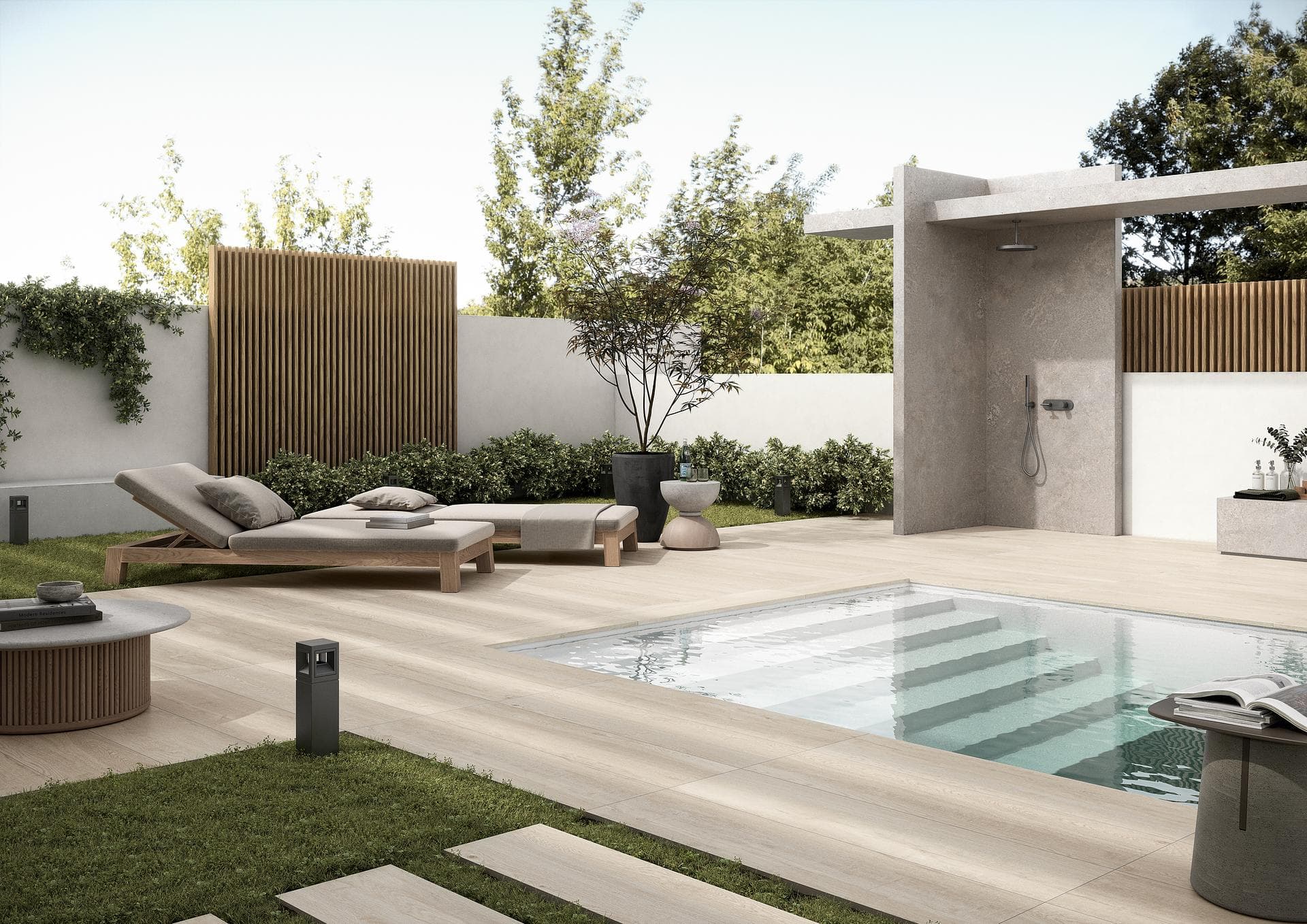 Poolside in beige wood-effect stoneware Outdoor poolside paved with matt beige wood-effect stoneware planks, sun lounger, shower and hedges
