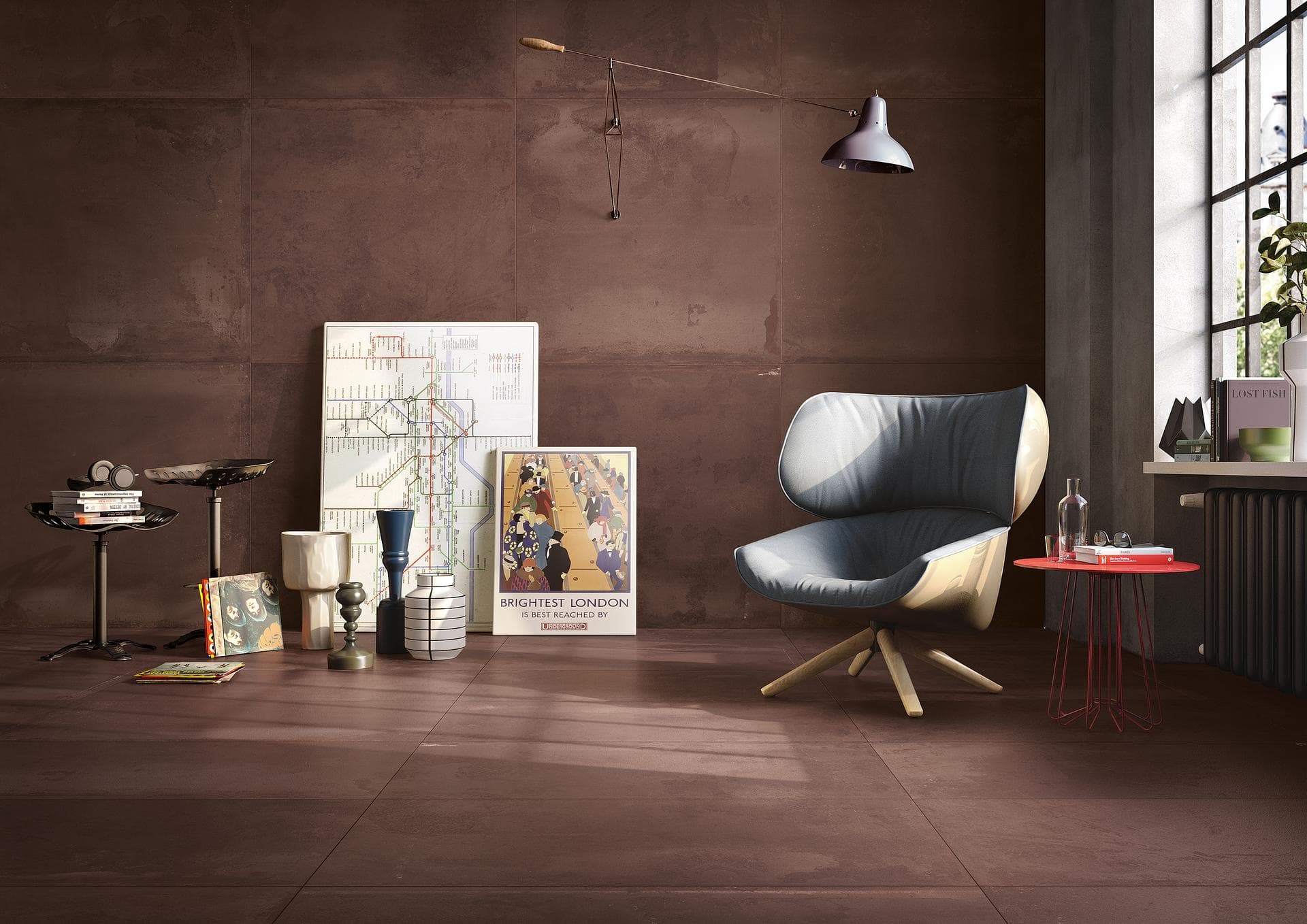 Living room with matt brown tiled walls and floor Living room with matt brown tiled walls and floor, blue armchair, red side table and prints leaning on the floor