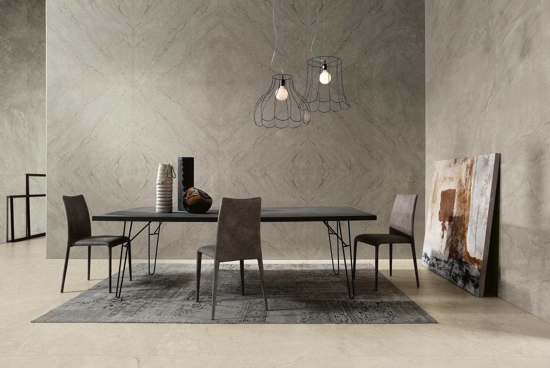 Dining room with grey marble-effect walls Dining room with dark table, glossy grey marble-effect wall tiles and satin white porcelain floor