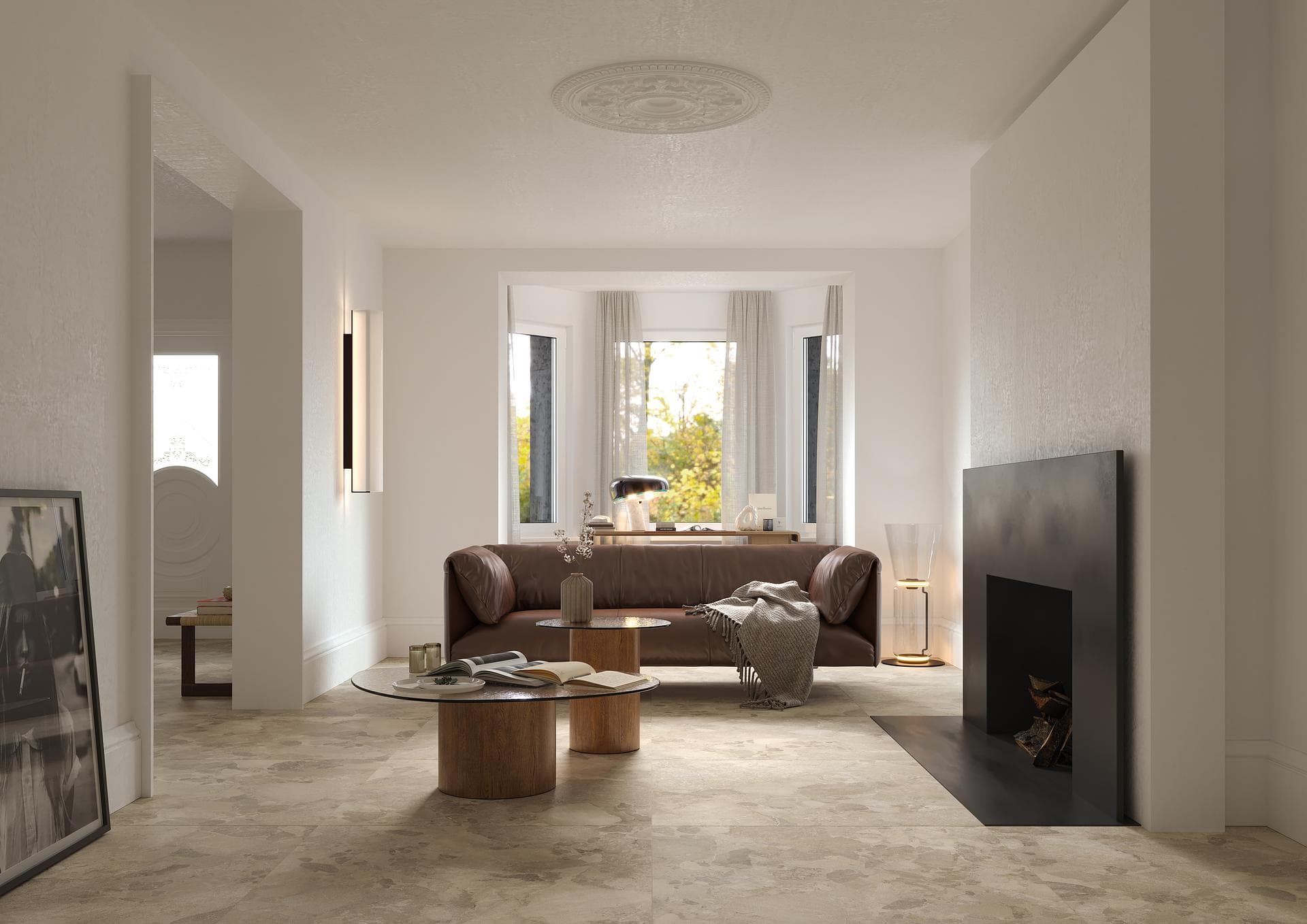 Living room with fireplace and stone-effect floor Living room with fireplace and leather sofa, floor in matte tortora stone-effect 90x90 tiles