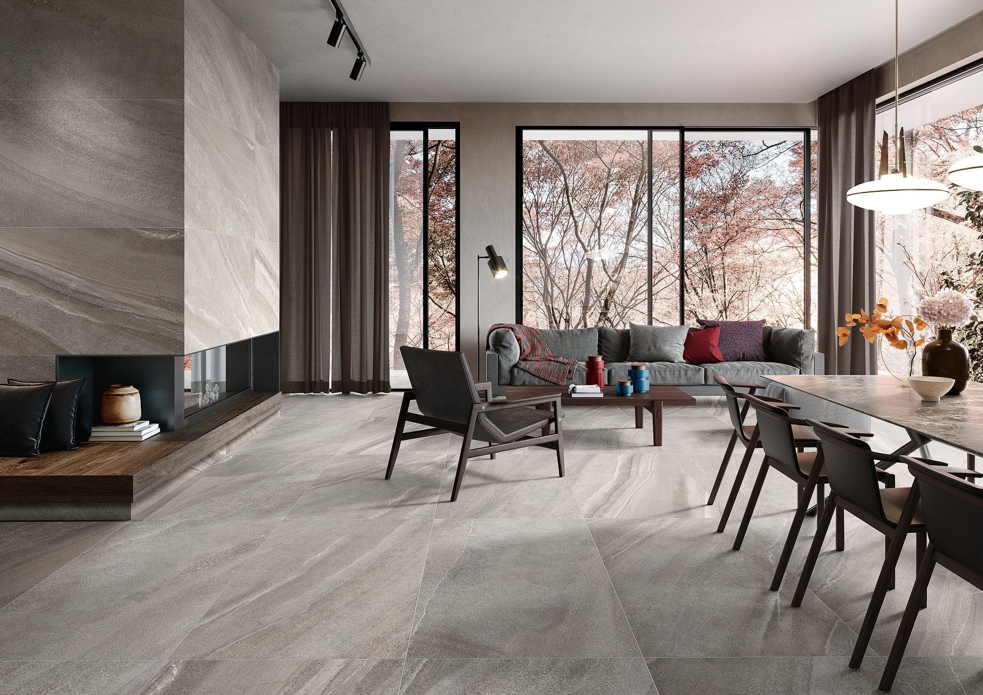Living room with dining area and fireplace Open living and dining room with fireplace, matt grey stone-effect floor and wall tiles