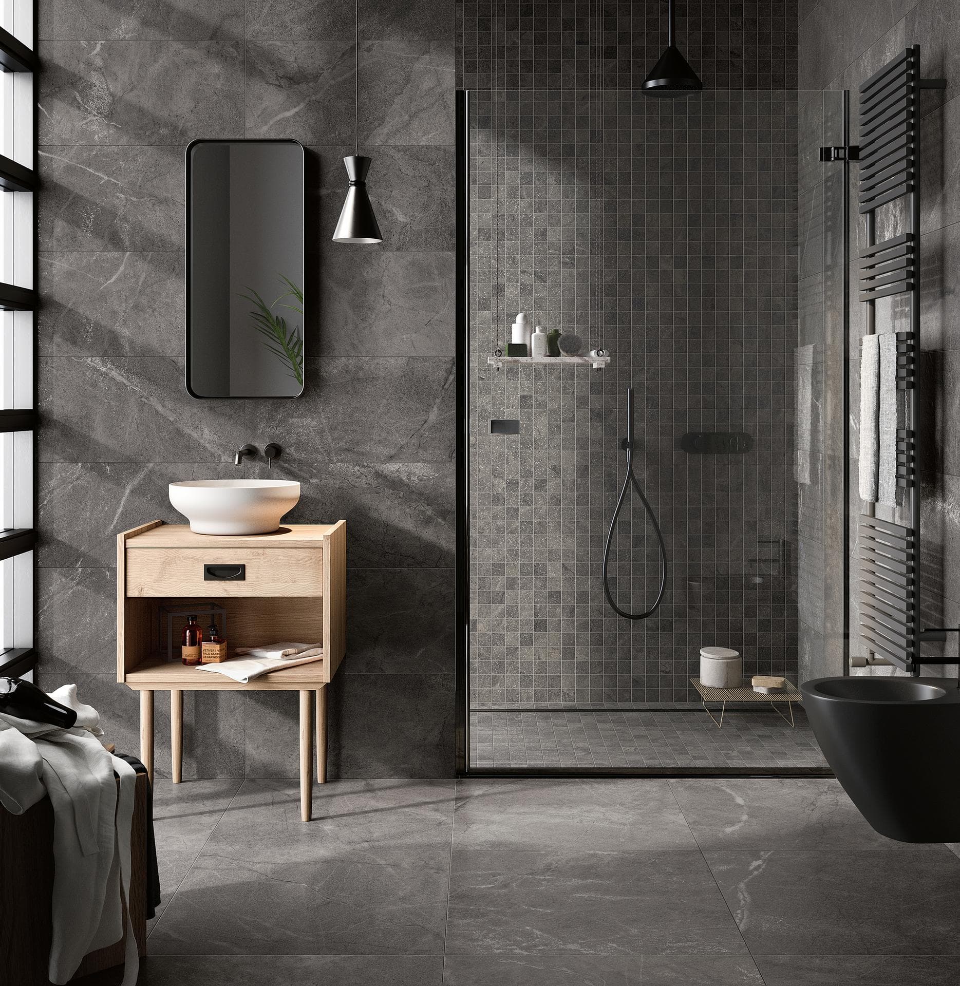 Bagno con gres effetto pietra grigio scuro Bagno con pareti e pavimento in gres effetto pietra grigio scuro opaco e mosaico nella doccia in vetro